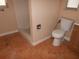 Bathroom with shower, toilet, and tile floors at 7101 Green St, New Port Richey, FL 34652