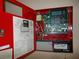 Interior view of a fire alarm control panel with wiring and battery backup at 7101 Green St, New Port Richey, FL 34652