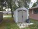 Tan colored storage shed in the backyard at 7101 Green St, New Port Richey, FL 34652