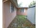View of the home's backyard with a shed at 7101 Green St, New Port Richey, FL 34652