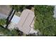 Aerial view of a house with a large backyard and surrounding trees at 7101 Green St, New Port Richey, FL 34652