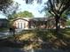 One-story house with a two-car garage and a well-maintained lawn at 7101 Green St, New Port Richey, FL 34652