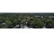 Aerial view of a lush, tree-lined neighborhood with houses at 7101 Green St, New Port Richey, FL 34652
