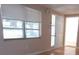 Bright living room with large window and tile floors at 7101 Green St, New Port Richey, FL 34652
