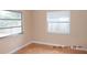 Simple bedroom with tile flooring and window coverings at 7101 Green St, New Port Richey, FL 34652