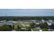 Aerial image showing commercial buildings and ocean views at 7101 Green St, New Port Richey, FL 34652