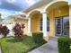 House entrance with double doors and columns under an arched entryway at 7827 Starfire Way, New Port Richey, FL 34654