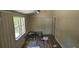 Bright bedroom with two windows and wood-look floors at 4375 Lindsey Loop, Dover, FL 33527
