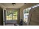 Bedroom with two large windows and backyard view at 4375 Lindsey Loop, Dover, FL 33527