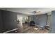 Living room with laminate floors and a recliner at 4375 Lindsey Loop, Dover, FL 33527
