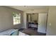 Bedroom with window, closet, and a small table at 4375 Lindsey Loop, Dover, FL 33527