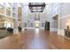 Spacious ballroom featuring hardwood floors, elegant lighting, and high ceilings, ideal for events at 5308 Cedarshake Ln, Valrico, FL 33596