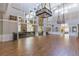 Spacious ballroom with open layout, stone fireplace, and decorative lighting at 5308 Cedarshake Ln, Valrico, FL 33596