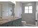 Bright bathroom featuring double vanity and a shower at 5308 Cedarshake Ln, Valrico, FL 33596