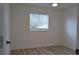 Bright bedroom features neutral walls and light-colored flooring and window at 5308 Cedarshake Ln, Valrico, FL 33596