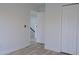 Bedroom featuring vinyl wood floors, white walls, and closet at 5308 Cedarshake Ln, Valrico, FL 33596