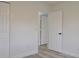 Neutral bedroom features vinyl floors and closet with folding doors at 5308 Cedarshake Ln, Valrico, FL 33596