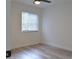 Bright bedroom features neutral walls, a ceiling fan and light-colored flooring at 5308 Cedarshake Ln, Valrico, FL 33596