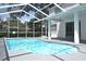 Beautiful screened-in pool area with a sparkling pool and deck at 5308 Cedarshake Ln, Valrico, FL 33596