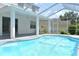 Backyard pool with screened enclosure and plenty of space for outdoor lounging at 5308 Cedarshake Ln, Valrico, FL 33596