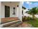 Brick paver porch and steps leading to modern front door at 2724 W Dewey St, Tampa, FL 33607