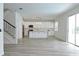 Open concept kitchen with white cabinets and a large island at 5308 Cedarshake Ln, Valrico, FL 33596