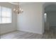 Bright dining room with hardwood floors and elegant chandelier at 5308 Cedarshake Ln, Valrico, FL 33596