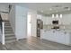 Modern kitchen with white cabinets, stainless steel appliances, and quartz countertops at 5308 Cedarshake Ln, Valrico, FL 33596