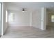 Spacious living room with wood-look floors and stone accent wall at 5308 Cedarshake Ln, Valrico, FL 33596