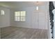Bright living room with hardwood floors and double doors at 5308 Cedarshake Ln, Valrico, FL 33596