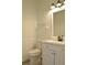 Clean bathroom, white vanity, and wood-look floors at 5308 Cedarshake Ln, Valrico, FL 33596