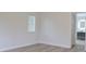 Bedroom with wood-look floors and access to bathroom at 5308 Cedarshake Ln, Valrico, FL 33596