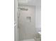 Large walk-in shower with marble tile and rain shower head at 5308 Cedarshake Ln, Valrico, FL 33596