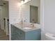 Bathroom with dual vanity, granite countertop, and shiplap accent wall at 5308 Cedarshake Ln, Valrico, FL 33596