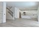 Modern kitchen with white cabinets, large island, and stainless steel appliances at 5308 Cedarshake Ln, Valrico, FL 33596