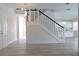 Modern staircase with metal balusters and white risers at 5308 Cedarshake Ln, Valrico, FL 33596