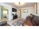Living room with leather furniture and a large TV at 4622 Paloverde Dr, New Port Richey, FL 34652