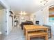Bright dining area with a farmhouse table and bench seating at 4622 Paloverde Dr, New Port Richey, FL 34652