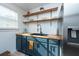 Modern kitchen with a farmhouse sink and butcher block countertop at 4622 Paloverde Dr, New Port Richey, FL 34652