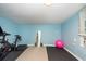 Exercise room with Peloton bike and yoga mat at 4622 Paloverde Dr, New Port Richey, FL 34652