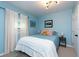 Bedroom with blue bedding and window coverings at 4622 Paloverde Dr, New Port Richey, FL 34652