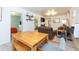 Open concept living and dining area with a rustic wooden table at 4622 Paloverde Dr, New Port Richey, FL 34652