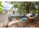 Backyard view showing a partially fenced area with kayaks and paddleboard at 4622 Paloverde Dr, New Port Richey, FL 34652