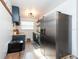 Updated kitchen featuring stainless steel fridge and dark blue cabinets at 4622 Paloverde Dr, New Port Richey, FL 34652