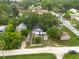 Wider aerial view of the property and surrounding houses at 4622 Paloverde Dr, New Port Richey, FL 34652