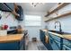 Eat-in kitchen, with wood countertops and a double sink at 4622 Paloverde Dr, New Port Richey, FL 34652