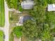 An overhead view of the house nestled amongst trees at 4622 Paloverde Dr, New Port Richey, FL 34652