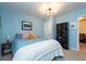 Bedroom with blue bedding and black cube shelving at 4622 Paloverde Dr, New Port Richey, FL 34652