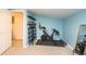 Exercise room with Peloton bike and shelving at 4622 Paloverde Dr, New Port Richey, FL 34652
