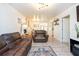 Open living room with leather couches and a dining table at 4622 Paloverde Dr, New Port Richey, FL 34652